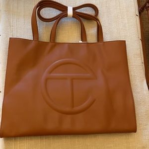 Large tan Telfar shopping bag tote. Never used.